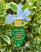 Close-up of mirrored acrylic name on personalized wooden Christmas ornament