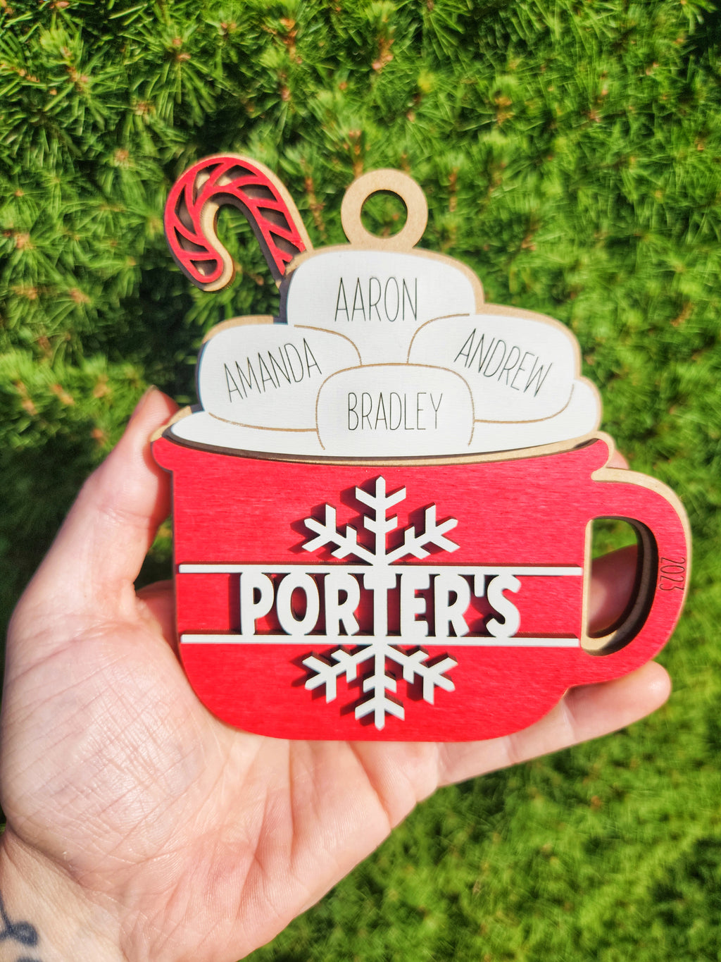 Personalized family Christmas ornament featuring names for up to nine family members